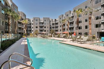 Resort-style junior olympic pool with spa and outdoor gaming area